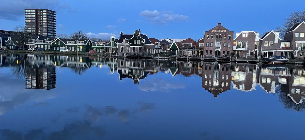 Green Zaan timber houses and brick warehouses along the water